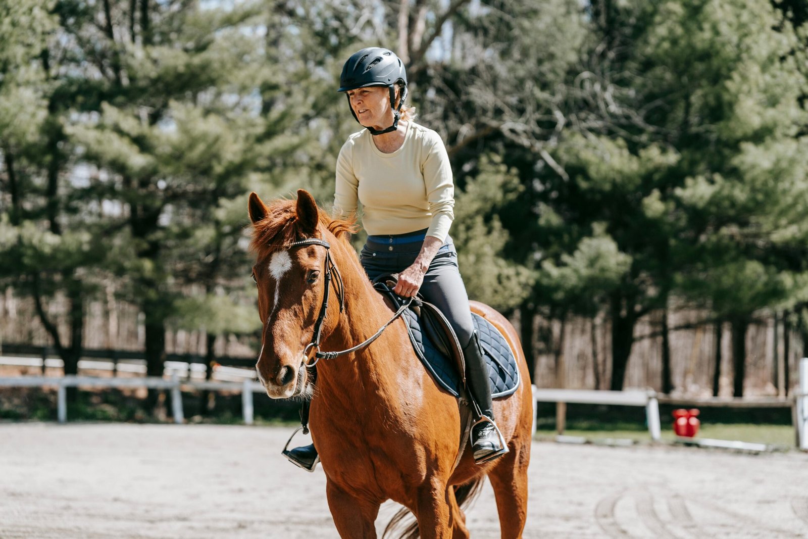 Horse rider gripping and bracing in the saddle while trying to maintain balance